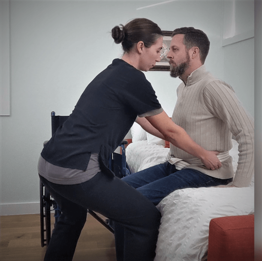 Caregiver supporting an older adult at home